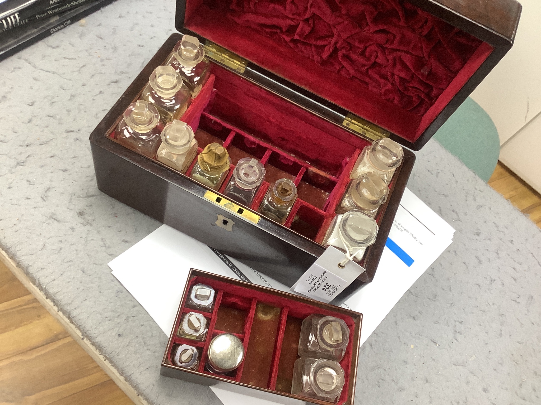 A 19th century mahogany cased travelling apothecary set with glass flasks, handle plate engraved ‘Dr.Tulk’, 26cm wide